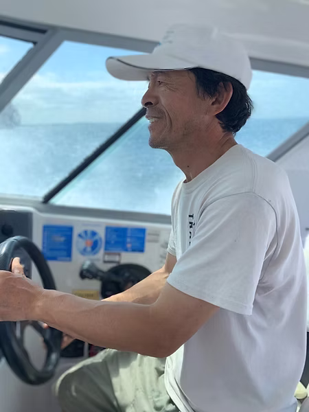 Captain Michael Wang at the helm of NZ Legend Boating